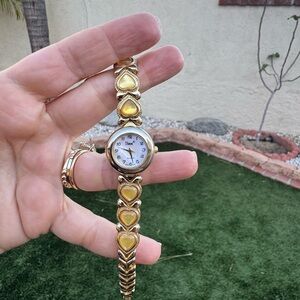 Vintage women’s gold and gemstones watch